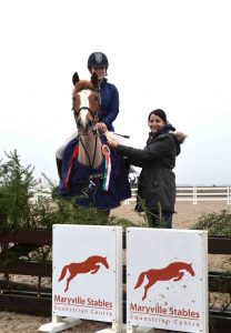 Claire Nulty (Bucas) congratulates Sarah Rohan and Portavadda Donna - Winners of the Bucas Maryville Spring Derby Cross 85cm Final (29/01/17)